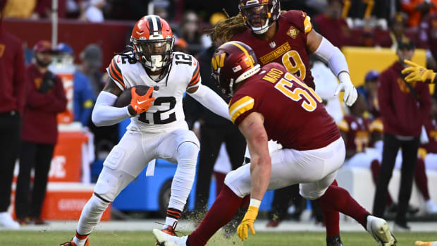 Jan 1, 2023; Landover, Maryland, USA; Cleveland Browns wide receiver Michael Woods II (12) runs after a catch as Washington C