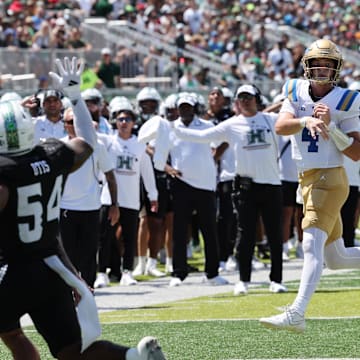 Aug 31, 2024; Honolulu, Hawaii, USA;  UCLA Bruins quarterback Ethan Garbers (4) throws an end zone  interception against the Hawaii Rainbow Warriors during the first quarter of an NCAA college football game at the Clarence T.C. Ching Athletics Complex. Mandatory Credit: Marco Garcia-Imagn Images