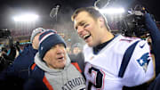 Jan 20, 2019; Kansas City, MO, USA; New England Patriots head coach Bill Belichick and quarterback Tom Brady (12) celebrate the win over the Kansas City Chiefs during overtime in the AFC Championship game at Arrowhead Stadium. 