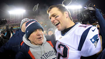 Jan 20, 2019; Kansas City, MO, USA; New England Patriots head coach Bill Belichick and quarterback Tom Brady (12) celebrate the win over the Kansas City Chiefs during overtime in the AFC Championship game at Arrowhead Stadium. 