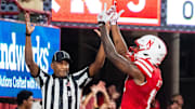 Sep 20, 2024; Lincoln, Nebraska, USA; Nebraska Cornhuskers wide receiver Isaiah Neyor (18) celebrates after scoring a touchdown against the Illinois Fighting Illini during the first quarter at Memorial Stadium.
