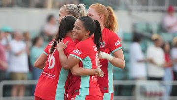 Jul 27, 2024; Kansas City, Missouri, USA; Kansas City Current midfielder Debinha (99) celebrates with midfielder Vanessa DiBernardo (16) after a gaol in the first half against Pachuca at CPKC Stadium. Mandatory Credit: Denny Medley-USA TODAY Sports