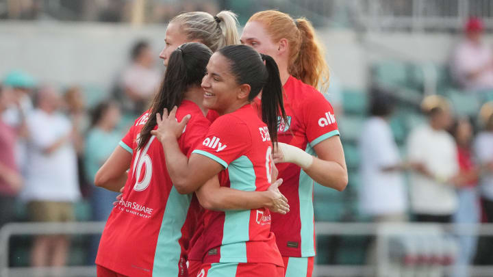 Jul 27, 2024; Kansas City, Missouri, USA; Kansas City Current midfielder Debinha (99) celebrates with midfielder Vanessa DiBernardo (16) after a gaol in the first half against Pachuca at CPKC Stadium. Mandatory Credit: Denny Medley-USA TODAY Sports