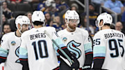 Apr 14, 2024; St. Louis, Missouri, USA; Seattle Kraken defenseman Adam Larsson (6) looks on with center Matty Beniers (10) and left wing Andre Burakovsky (95) during the thrid period of a hockey game against the St. Louis Blues at Enterprise Center. Mandatory Credit: Jeff Le-Imagn Images