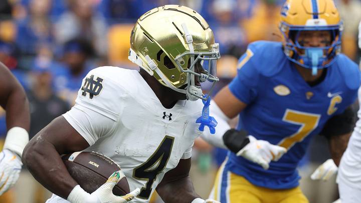 Nov 15, 2025; Pittsburgh, Pennsylvania, USA;  Notre Dame Fighting Irish running back Jeremiyah Love (4) runs the ball against the Pittsburgh Panthers during the second quarter at Acrisure Stadium. Mandatory Credit: Charles LeClaire-Imagn Images