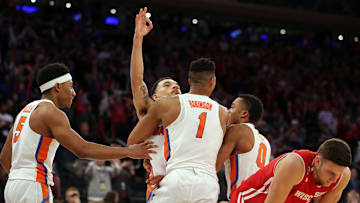 Mar 24, 2017; New York, NY, USA; Florida Gators guard Chris Chiozza (11) celebrates making the game winning shot against the Wisconsin Badgers in the semifinals of the East Regional of the 2017 NCAA Tournament at Madison Square Garden. Mandatory Credit: Brad Penner-Imagn Images