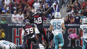 Dec 15, 2024; Houston, Texas, USA; Houston Texans linebacker Christian Harris (48) reacts after the Texans recover a fumble during the second quarter against the Miami Dolphins at NRG Stadium. Mandatory Credit: Troy Taormina-Imagn Images