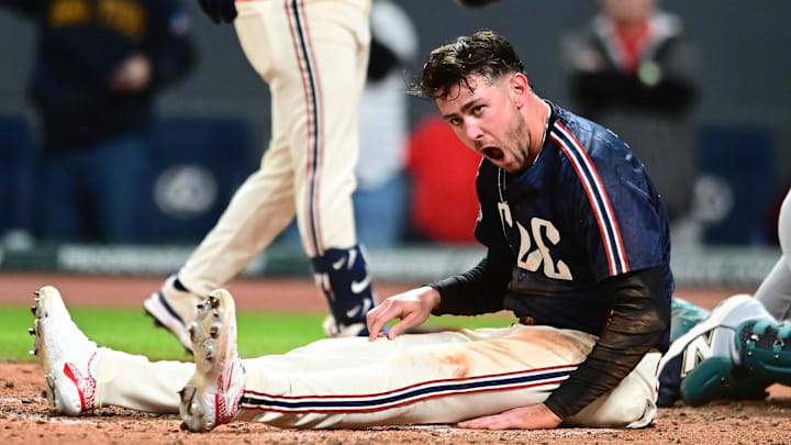 Aug 29, 2025: Cleveland Guardians right fielder Nolan Jones (22) reacts after scoring under the tag of Seattle Mariners catcher Cal Raleigh (not pictured) during the ninth inning at Progressive Field. 