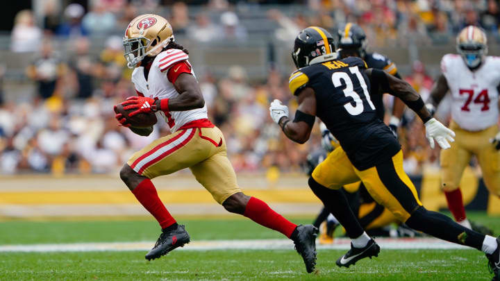 Sep 10, 2023; Pittsburgh, Pennsylvania, USA; San Francisco 49ers wide receiver Brandon Aiyuk (11) runs with the ball after making a catch against the Pittsburgh Steelers during the first half at Acrisure Stadium. Mandatory Credit: Gregory Fisher-USA TODAY Sports