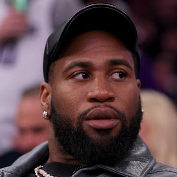 Apr 4, 2024; New York, New York, USA; New York Jets linebacker Haason Reddick sits court side during the fourth quarter between the New York Knicks and the Sacramento Kings at Madison Square Garden. 