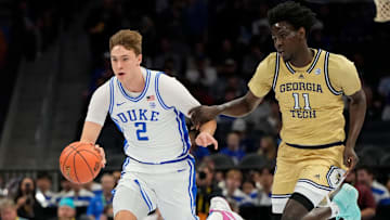 Mar 13, 2025; Charlotte, NC, USA; Duke Blue Devils forward Cooper Flagg (2) on the fast break as Georgia Tech Yellow Jackets forward Baye Ndongo (11) defends in the first half at Spectrum Center. Mandatory Credit: Bob Donnan-Imagn Images