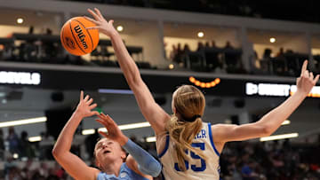 Mar 28, 2025; Birmingham, AL, USA; Duke Blue Devils forward Toby Fournier (35) blocks a shot by North Carolina Tar Heels forward Alyssa Ustby (1) at Legacy Arena in the Sweet 16. Duke advanced to the Elite 8 with a 47-38 victory.