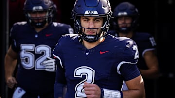 Nov 1, 2025; East Hartford, Connecticut, USA; UConn Huskies quarterback Joe Fagnano (2) runs to the field to warm up before the start of the game against the UAB Blazers at Pratt & Whitney Stadium at Rentschler Field. Mandatory Credit: David Butler II-Imagn Images