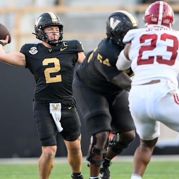 Oct 5, 2024; Nashville, Tennessee, USA;  Vanderbilt Commodores quarterback Diego Pavia (2) scrambles against the Alabama Crimson Tide during the second half at FirstBank Stadium. Mandatory Credit: Steve Roberts-Imagn Images