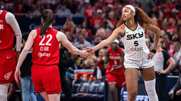 Indiana Fever guard Caitlin Clark and Chicago Sky forward Angel Reese shake hands during a game at Gainbridge Fieldhouse. Indiana Fever guard Caitlin Clark and Chicago Sky forward Angel Reese shake hands during a game at Gainbridge Fieldhouse.