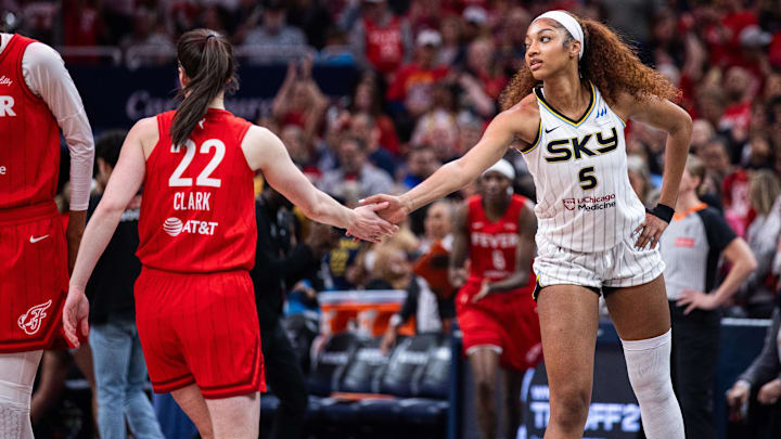 Indiana Fever guard Caitlin Clark and Chicago Sky forward Angel Reese shake hands before the game at Gainbridge Fieldhouse. Indiana Fever guard Caitlin Clark and Chicago Sky forward Angel Reese shake hands before the game at Gainbridge Fieldhouse.