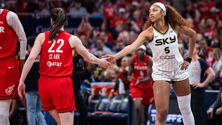 May 17, 2025; Indianapolis, Indiana, USA; Indiana Fever guard Caitlin Clark (22) and Chicago Sky forward Angel Reese (5) shake hands before the game at Gainbridge Fieldhouse. Mandatory Credit: Trevor Ruszkowski-Imagn Images