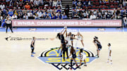 Chicago Sky center Cardoso battles for the ball with Indiana Fever forward Boston during tip-off of a WNBA game at United Center. 
