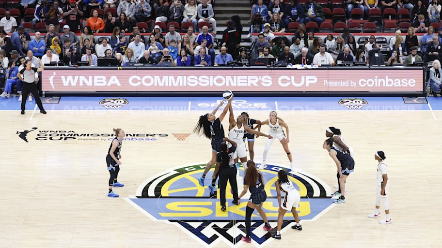Chicago Sky center Cardoso battles for the ball with Indiana Fever forward Boston during tip-off of a WNBA game at United Center.  | Kamil Krzaczynski-Imagn Images