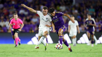 Jul 6, 2024; Orlando, Florida, USA; Orlando City forward Ramiro Enrique (7) and D.C. United defender Christopher McVey (97) battle for the ball in the second half at Inter&Co Stadium. Mandatory Credit: Nathan Ray Seebeck-USA TODAY Sports