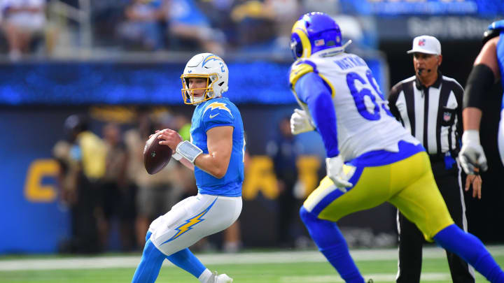 Aug 17, 2024; Inglewood, California, USA; Los Angeles Chargers quarterback Easton Stick (2) moves out to pass against the Los Angeles Rams during the first half at SoFi Stadium. Mandatory Credit: Gary A. Vasquez-USA TODAY Sports