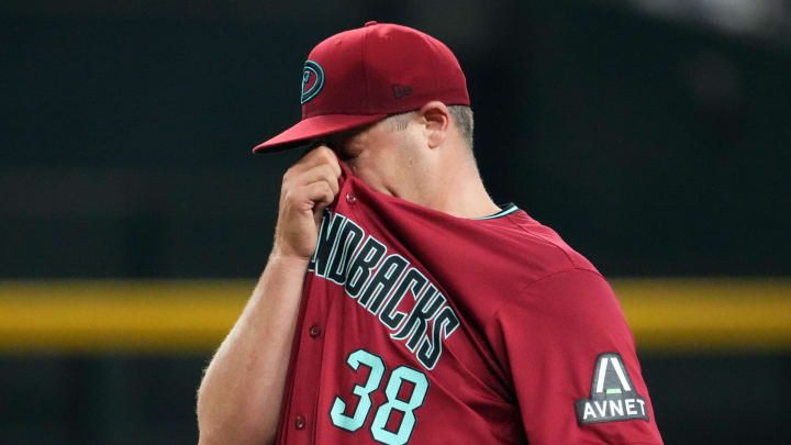 Jul 28, 2024; Phoenix, Arizona, USA; Arizona Diamondbacks pitcher Paul Sewald (38) reacts against the Pittsburgh Pirates during the ninth inning at Chase Field. Mandatory Credit: Joe Camporeale-USA TODAY Sports