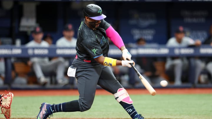 Jul 13, 2024; St. Petersburg, Florida, USA; Tampa Bay Rays first baseman Yandy Diaz (2) hits an rbi double against the Cleveland Guardians in the third inning at Tropicana Field. 