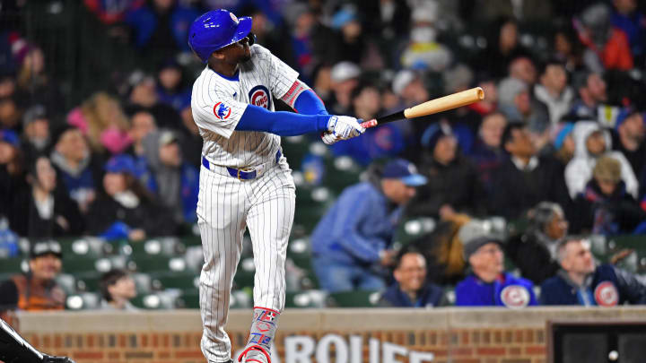 Apr 20, 2024; Chicago, Illinois, USA; Chicago Cubs outfielder Alexander Canario (4) hits a home run during the sixth inning against the Miami Marlins at Wrigley Field.