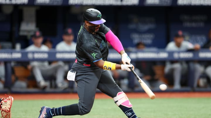 Jul 13, 2024; St. Petersburg, Florida, USA; Tampa Bay Rays first baseman Yandy Diaz (2) hits an RBI double against the Cleveland Guardians in the third inning at Tropicana Field.