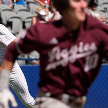 Mississippi State third baseman Ace Reese (3) fields a bunt by Texas A&M second baseman Ben Royo (10) but makes a wild throw to first in the first round of the SEC Baseball Tournament at the Hoover Met.