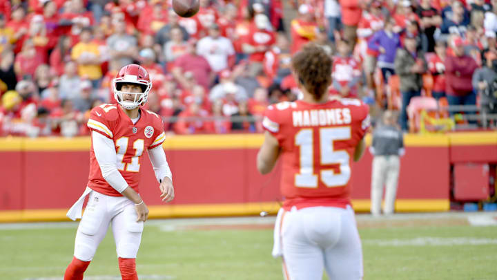 Nov 26, 2017; Kansas City, MO, USA; Kansas City Chiefs quarterback Alex Smith (11) throws passes to quarterback Patrick Mahomes (15) on the sidelines during the second half against the Buffalo Bills at Arrowhead Stadium. Mandatory Credit: Denny Medley-Imagn Images