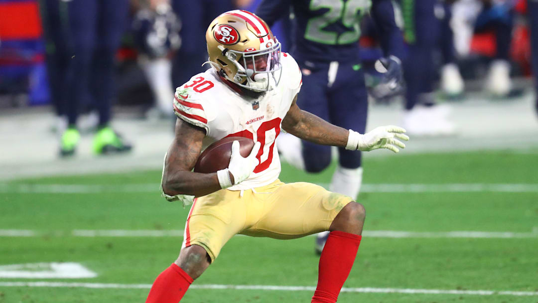 Jan 3, 2021; Glendale, Arizona, USA; San Francisco 49ers running back Jeff Wilson Jr. (30) against the Seattle Seahawks at State Farm Stadium. Mandatory Credit: Mark J. Rebilas-Imagn Images