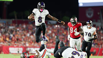 Oct 21, 2024; Tampa, Florida, USA; Baltimore Ravens quarterback Lamar Jackson (8) runs with the ball against the Tampa Bay Buccaneers in the second quarter at Raymond James Stadium. Mandatory Credit: Nathan Ray Seebeck-Imagn Images