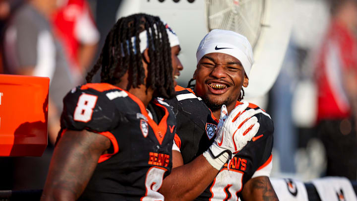 Oregon State Beavers running back Jam Griffin (8) and Oregon State Beavers running back Anthony Hankerson (0) cool off on the sidelines during the second half of the game against Idaho State on Saturday, Aug. 31, 2024 at Reser Stadium in Corvallis, Ore.