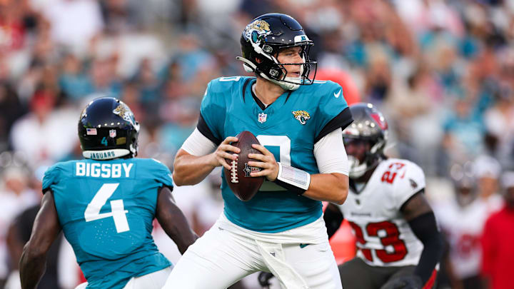 Aug 17, 2024; Jacksonville, Florida, USA; Jacksonville Jaguars quarterback Mac Jones (10) drops back to pass against the Tampa Bay Buccaneers in the first quarter during a preseason game at EverBank Stadium.