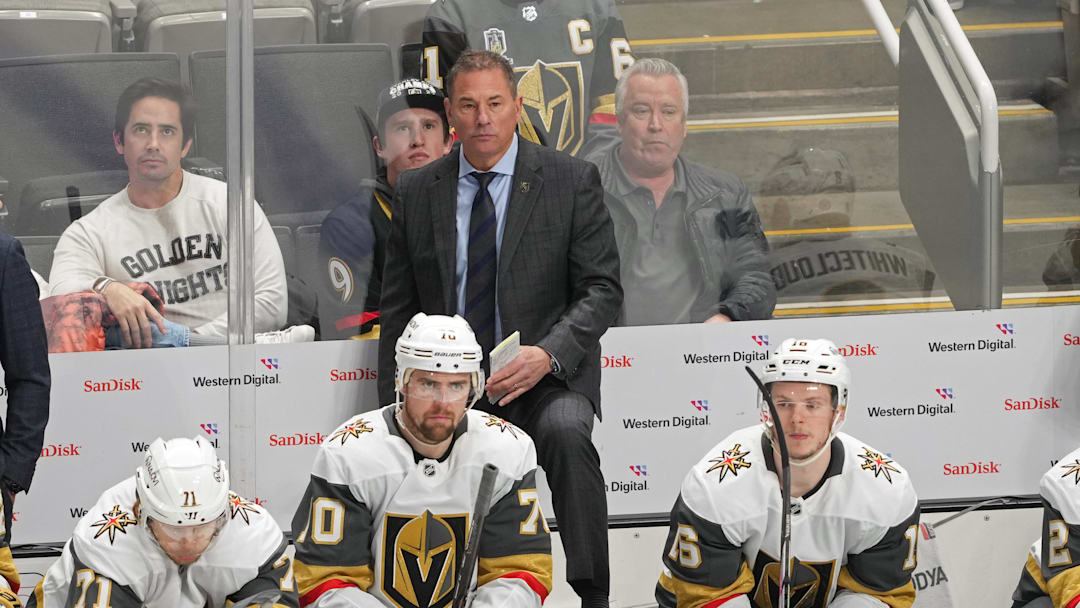 Jan 7, 2025; San Jose, California, USA; Vegas Golden Knights head coach Bruce Cassidy (center back) stands behind the bench during the third period against the San Jose Sharks at SAP Center at San Jose. Mandatory Credit: Darren Yamashita-Imagn Images
