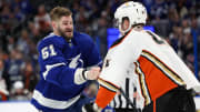 Jan 13, 2024; Tampa, Florida, USA;  Tampa Bay Lightning left wing Austin Watson (51) shoves Anaheim Ducks left wing Ross Johnston (44) in the second period at Amalie Arena. Mandatory Credit: Nathan Ray Seebeck-USA TODAY Sports