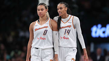 Sep 17, 2025; Brooklyn, New York, USA; Phoenix Mercury forward DeWanna Bonner (14) talks with forward Satou Sabally (0) during game two of round one for the 2025 WNBA Playoffs against the New York Liberty at Barclays Center. Mandatory Credit: Wendell Cruz-Imagn Images