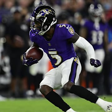 Sep 19, 2021; Baltimore, Maryland, USA; Baltimore Ravens wide receiver Marquise Brown (5) runs with the ball during the first half against the Kansas City Chiefs  at M&T Bank Stadium. Mandatory Credit: Tommy Gilligan-Imagn Images