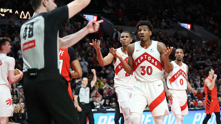 Mar 16, 2025; Portland, Oregon, USA; Toronto Raptors guard Ochai Agbaji (30) and Raptors’ center Orlando Robinson (21) react after being called for a foul against Portland Trail Blazers in the second half at Moda Center. Mandatory Credit: Jaime Valdez-Imagn Images