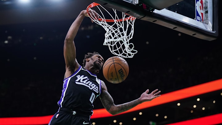 Jan 10, 2025; Boston, Massachusetts, USA; Sacramento Kings guard Malik Monk (0) drives to the basket against the Boston Celtics in the first quarter at TD Garden. Mandatory Credit: David Butler II-Imagn Images