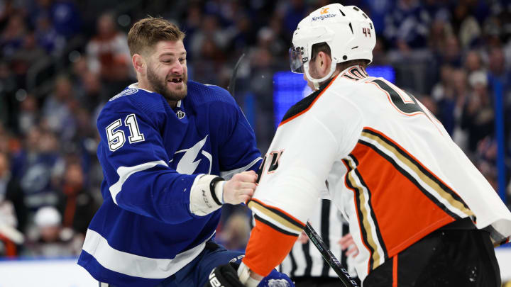 Jan 13, 2024; Tampa, Florida, USA;  Tampa Bay Lightning left wing Austin Watson (51) shoves Anaheim Ducks left wing Ross Johnston (44) in the second period at Amalie Arena. Mandatory Credit: Nathan Ray Seebeck-USA TODAY Sports