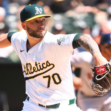 May 25, 2024; Oakland, California, USA; Oakland Athletics relief pitcher Lucas Erceg (70) pitched the ball against the Houston Astros during the seventh inning at Oakland-Alameda County Coliseum. Mandatory Credit: Kelley L Cox-USA TODAY Sports