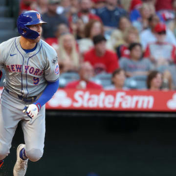 Aug 2, 2024; Anaheim, California, USA;  New York Mets left fielder Brandon Nimmo (9) hits a single during the third inning against the Los Angeles Angels at Angel Stadium. Mandatory Credit: Kiyoshi Mio-USA TODAY Sports