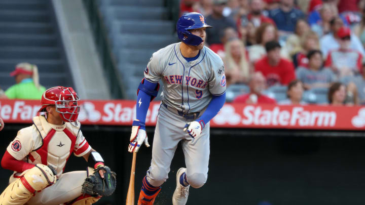 Aug 2, 2024; Anaheim, California, USA;  New York Mets left fielder Brandon Nimmo (9) hits a single during the third inning against the Los Angeles Angels at Angel Stadium. Mandatory Credit: Kiyoshi Mio-USA TODAY Sports