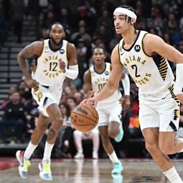 Mar 22, 2023; Toronto, Ontario, CAN;  Indiana Pacers guard Andrew Nembhard (2) brings the ball upcourt ahead of forwards Oshae Brissett (12) and Bennedict Mathurin (00) in the first half at Scotiabank Arena. Mandatory Credit: Dan Hamilton-Imagn Images