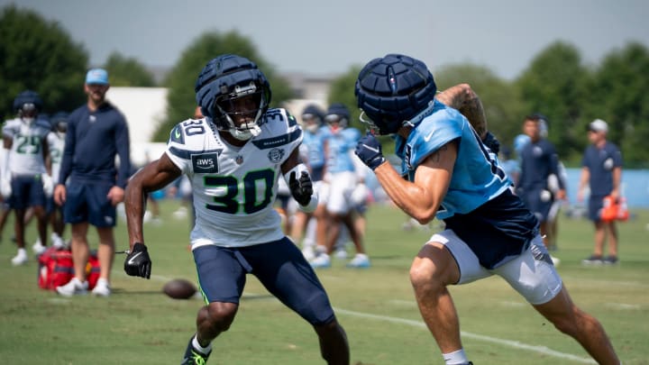 Seattle Seahawks cornerback Michael Jackson (30) guards Tennessee Titans wide receiver Mason Kinsey (12) at Ascension Saint Thomas Sports Park in Nashville, Tenn., Thursday, Aug. 15, 2024. This is the second day of the Titans joint practice with the Seattle Seahawks.