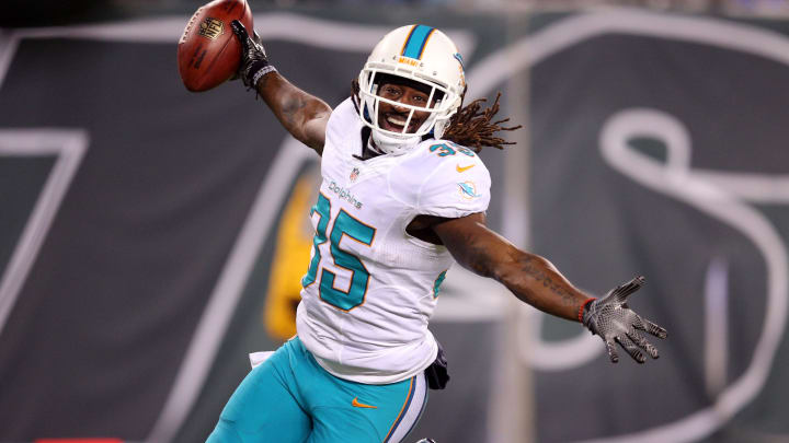 Miami Dolphins safety Walt Aikens (35) celebrates after scoring a touchdown against the New York Jets on a blocked punt during the third quarter at MetLife Stadium in a 2016 game.