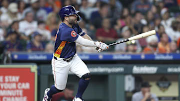 Sep 8, 2024; Houston, Texas, USA; Houston Astros second baseman Jose Altuve (27) hits an RBI single during the fifth inning against the Arizona Diamondbacks at Minute Maid Park. 