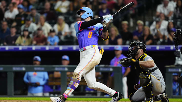 Aug 1, 2025; Denver, Colorado, USA; Colorado Rockies center fielder Brenton Doyle (9) hits a two run walk off home run in the ninth inning against the Pittsburgh Pirates at Coors Field. Aug 1, 2025; Denver, Colorado, USA; Colorado Rockies center fielder Brenton Doyle (9) hits a two run walk off home run in the ninth inning against the Pittsburgh Pirates at Coors Field.